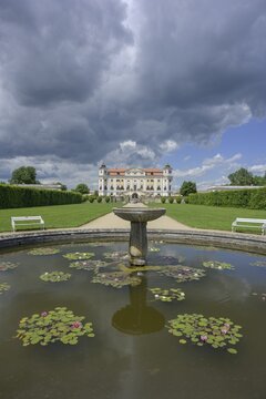 View of the castle from fountain with water lilies, Milotice u Kyjova, South Moravian Region, Czech Republic