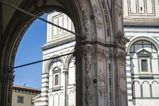 View through an ornate marble arch of the Baptistery of San Giovanni, baptistery, UNESCO World Heritage Site, old town, Florence, Tuscany, Italy