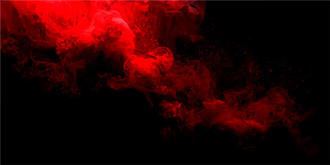 Abstract vibrant red smoke swirls dynamically against a stark black background, creating a visually striking and dramatic effect. © Ateş