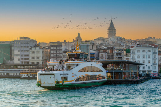 Istanbul, Turkey: May 18, 2026: Passenger ferry docked at Karak&ouml;y pier with Galata Tower in background at sunset
