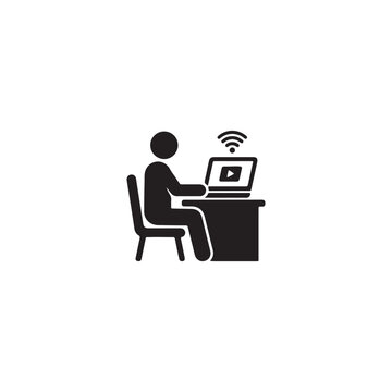 Person sitting at a desk using a laptop with wifi connection