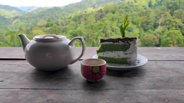 Closeup Green Tea Cake with Hot Green Tea is Morning Breakfast at  Green Tea Garden Farm Agriculture Cafe in Mae tang Chiang Mai Thailand - Travel Nature Park and Outdoor Dolly in food 