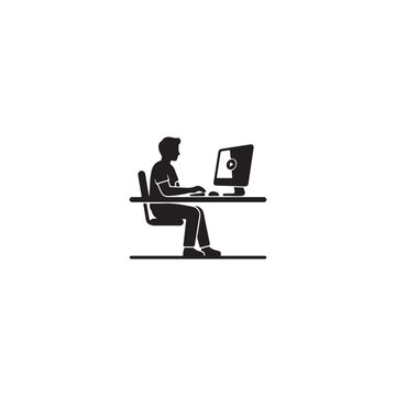 Person sitting at a desk working on a computer icon