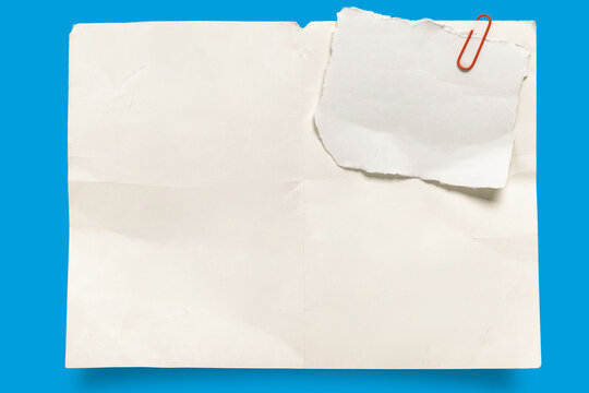 Vintage blank paper texture with red paperclip