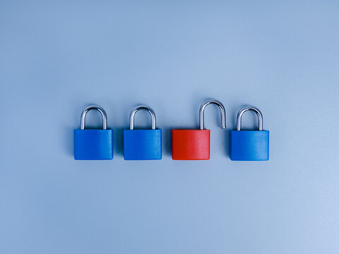Blue locked and red unlocked padlocks representing cybersecurity, data security, access control, authentication, identity protection, vulnerability, security breach, risk management and digital trust.