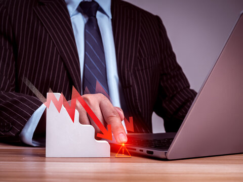 Business professional analyzing cybersecurity risk on laptop. Threat detection, attack prevention, data protection, digital security, risk management, and enterprise cyber resilience concept.