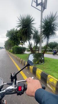 POV Motorcycle Ride with Side Mirror View on Rainy Road in Islamabad, Pakistan