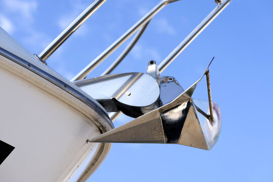 Boat anchor mooring system against blue sky