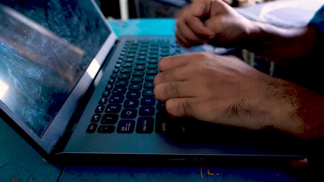 An anxious person feeling frustrated with a slow laptop computer, waiting nervously with hands raised in despair over technology performance issues and workplace stress.