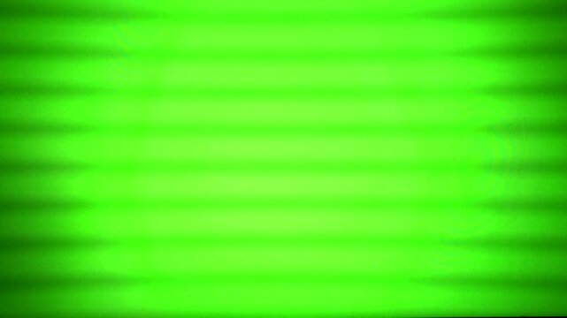 Bright green screen display with rolling lines and flicker effect, capturing chroma key background texture, digital television static, and abstract broadcast technology patterns.