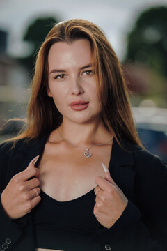 Stunning female model posing outdoors with professional off camera flash