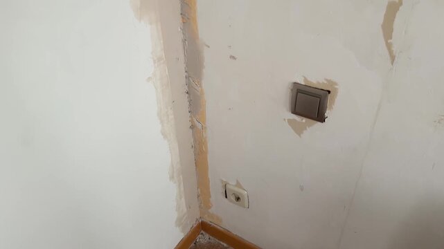 Apartment room corner during wall renovation process