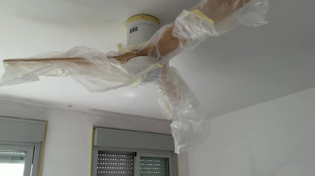 Tilting shot of a room prepared for painting and renovation