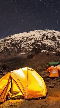 Mount Kilimanjaro. Kilimanjaro National Park in Tanzania, Africa. Trekking and climbing to the summit. Time lapse. Night video in starry sky.