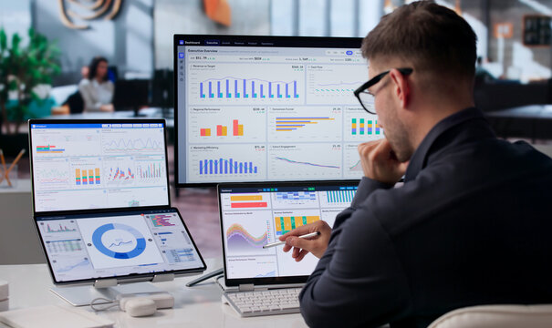 Young Data Analyst Studies Financial KPIs