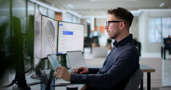 Man Organizing Corporate Event Schedule Using Laptop