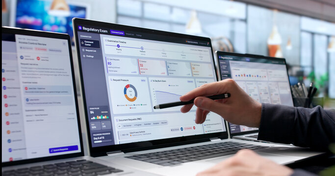 Man Examines Compliance Data And Regulatory Findings