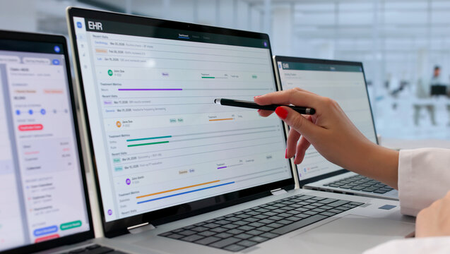 Young Female Doctor Reviews Patient Health Data