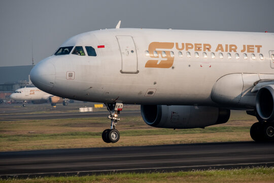 Jakarta, Indonesia - July 15, 2026: Close-up of the nose and cockpit of a Super Air Jet Airbus A320 during landing at Soekarno-Hatta International Airport.