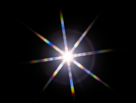 a starburst effect with distinct rainbow-colored diffraction streaks, which occurs when white light from a single point source passes through a specialized optical pattern or structure