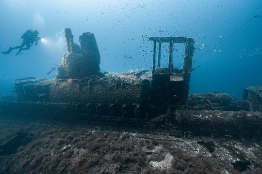 Diver exploring historic Rubis underwater submarine wreck