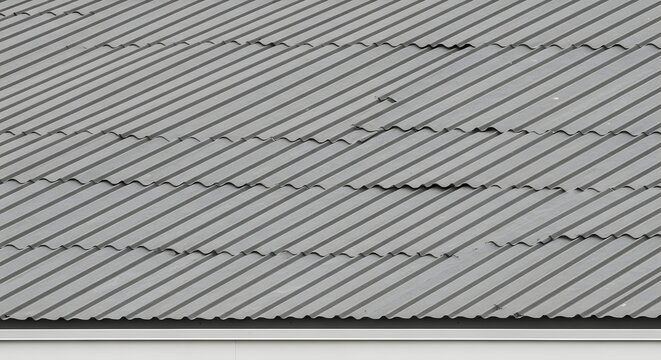 Close up view of a grey corrugated metal roof texture.
