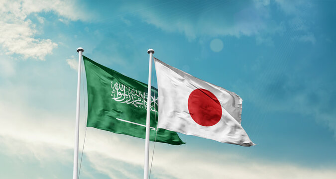Saudi Arabia and Japan friendship flags are waving in the sky. Two country flag for agreement or deal. Saudi Arabian Japan national flag for commitment.