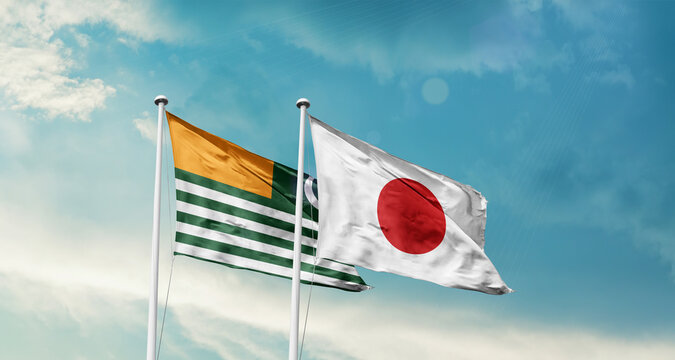 Kashmir and Japan friendship flags are waving in the sky. Two country flag for agreement or deal. 5th febuary Kashmir national flag for solidarity day.