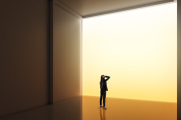 Fototapeta premium Woman standing alone in a vast minimalist room before a glowing opening, symbolizing opportunity, transition, ambition, creative vision, and personal growth.