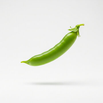 Single fresh green pea pod floating against white background, studio shot of healthy vegetable.
