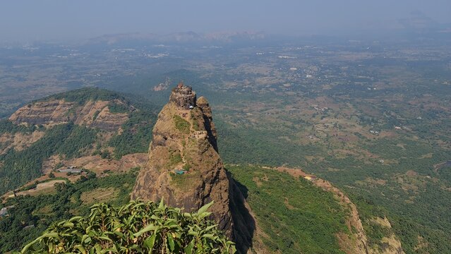 Kalavantin Durg pinnacle with trekkers climbing steep steps near Prabalgad Maharashtra India