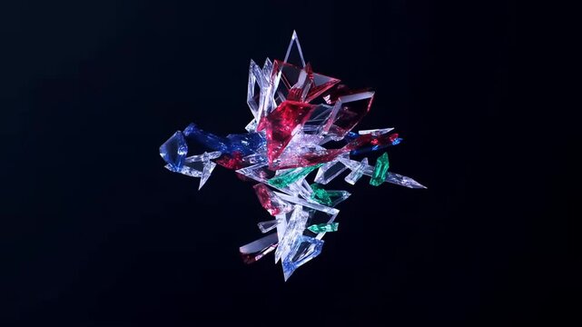 Tracking shot of colored glass shards colliding and converging into crystalline cluster in dark studio space