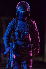 Obraz premium Tactical Soldier In Night Operations Wearing Ballistic Helmet Body Armor And Holding Rifle