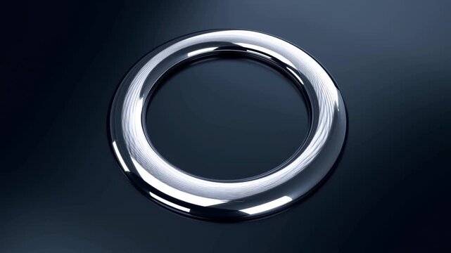 Static shot of chrome ring slowly rotating on dark reflective surface under studio lighting close up product detail