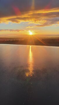 Aerial video flying over Lake Keepit Dam and the surrounding landscape in NSW, Australia. The expansive reservoir, dam wall and rolling countryside