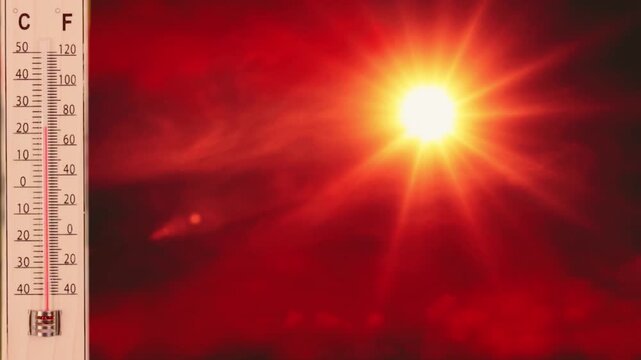 Extreme Heat Wave Concept with Thermometer Showing High Temperature and Blazing Sun
