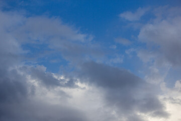 Obraz premium Blue sky with soft white and gray clouds background overcast weather