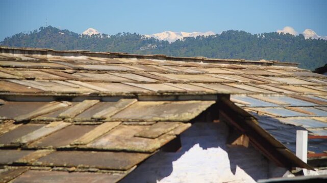 Traditional Stone Slate Roof of Village House in Almora with Himalayan Snow Peaks View