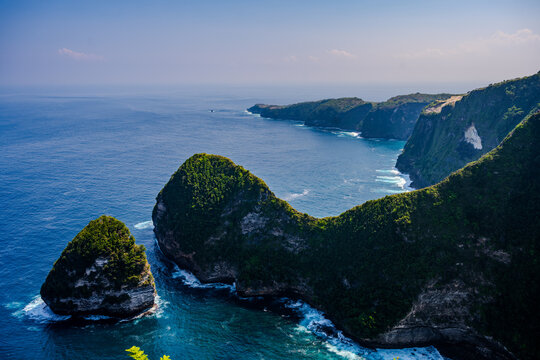 Dramatic green cliffs and blue ocean at Kelingking Beach on Nusa Penida