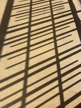 Shadow of fence on the floor