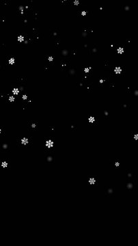 Vertical magical falling snow effect on black background, 4k 60fps isolated winter snowflake animation mobile portrait video overlay