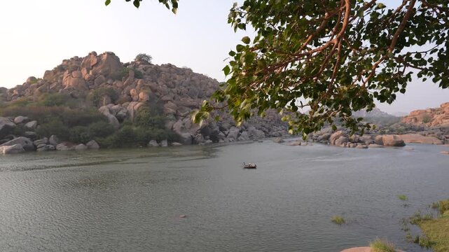 Traditional Coracle Boating on the Tungabhadra River, Hampi, Karnataka, India