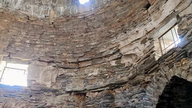 The stone dome inside Tash Rabat caravanserai in Kyrgyzstan. The footage highlights concentric masonry, skylight openings and preserved medieval architecture.