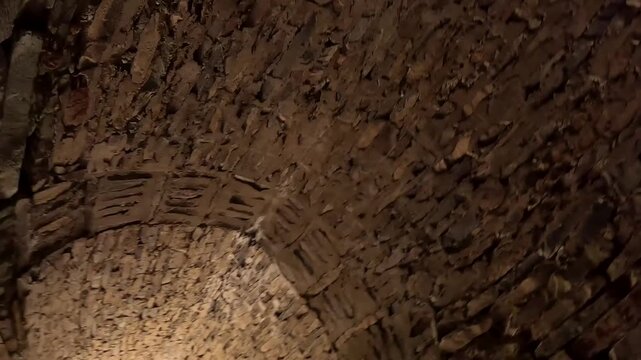 The main corridor inside Tash Rabat caravanserai in Kyrgyzstan. The video focuses on the vaulted ceiling, stone masonry and historic medieval architecture.