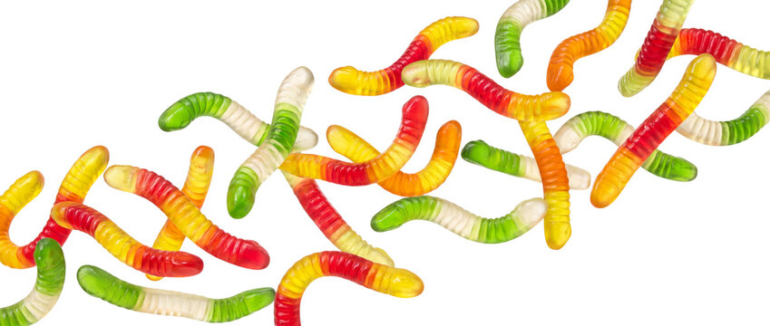 Colorful gummy worms scattered isolated on transparent background