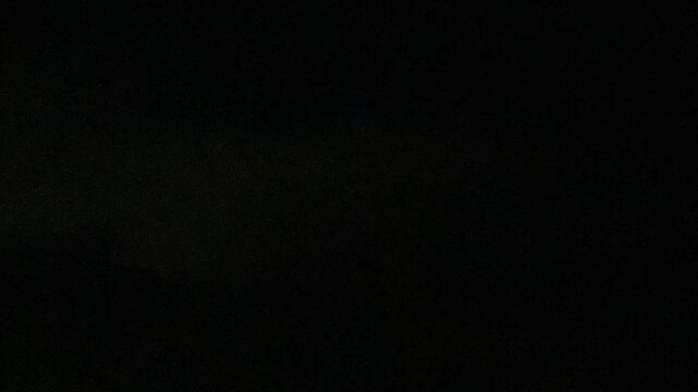 Lightning thunderstorm flash over the night dark sky on the horizon. Concept on topic weather, cataclysms.