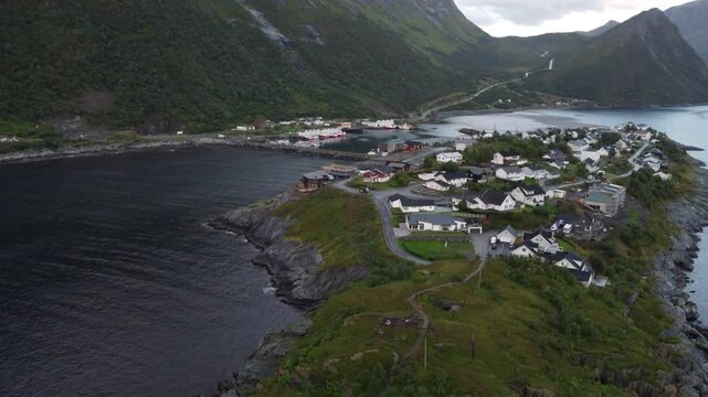 Aerial view of Husoy island village in Senja during golden sunset Norway