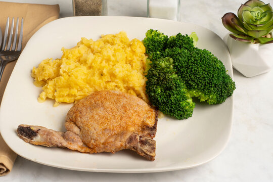 pork chop with  broccoli and chedder mash potatoes