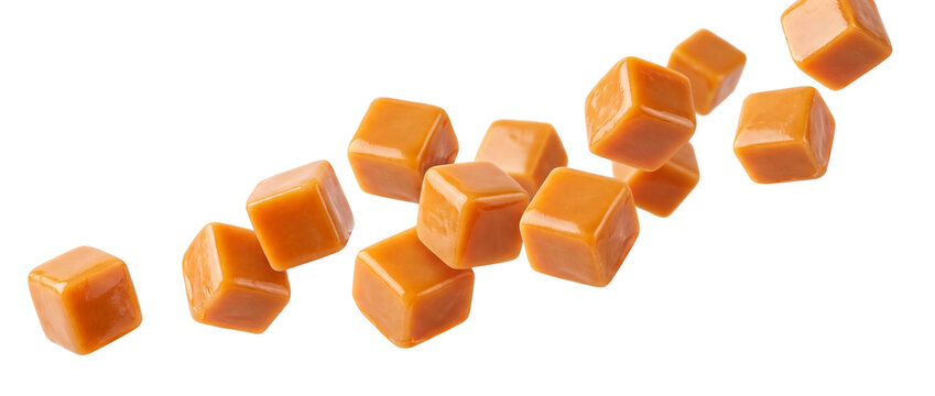 Caramel cubes falling isolated on transparent background