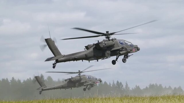Military Attack Helicopters Flying Over Training Area